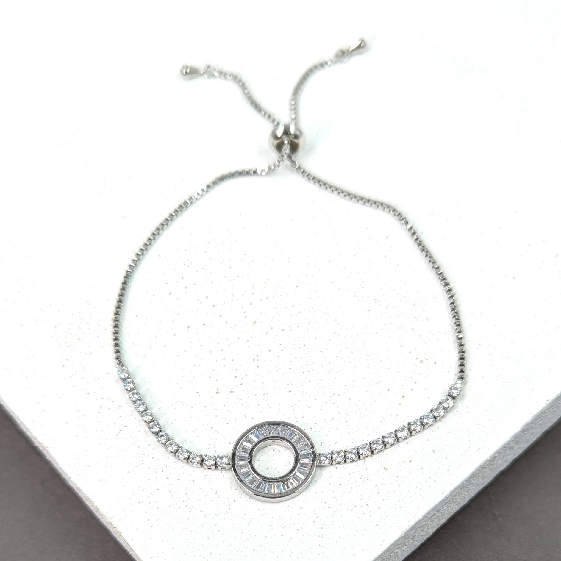 Friendship bracelet with baguette crystal set open circle